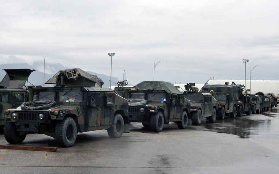 Dozens of Humvees, many packed with weapons or equipment, waiting on Saturday, April 9, 2016, to be loaded onto aircraft at Aviano Air Base, Italy, and transported to Germany to take part in the Saber Junction exercise involving the 173rd Airborne Brigade.