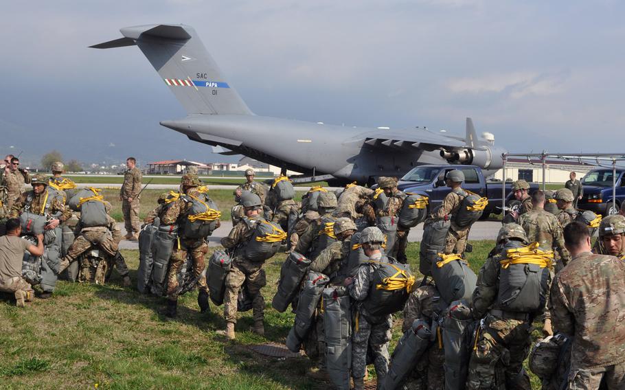 Soldiers from the 173rd Airborne Brigade get set to board a C-17 at Aviano Air Base, Italy, on Monday, April 11, 2016. The C-17 is from the Heavy Airlift Wing based at Papa Air Base in Hungary, along with other C-17s and C-130s from various other units,  dropped hundreds of troops and tons of equipment onto a drop zone near Hohenfels, Germany, as part of exercise Saber Junction.