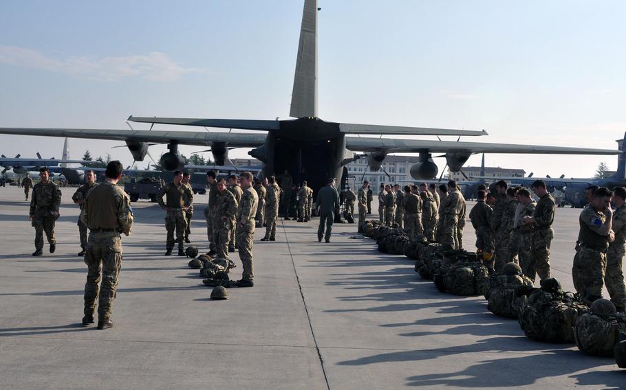 British soldiers with Company A, 2nd Battalion, Parachute Regiment, wait behind a C-130 on Tuesday, April 12, 2016, before jumping into Hohenfels, Germany, as part of exercise Saber Junction involving more than 4,000 personnel from the United States and several NATO allies.