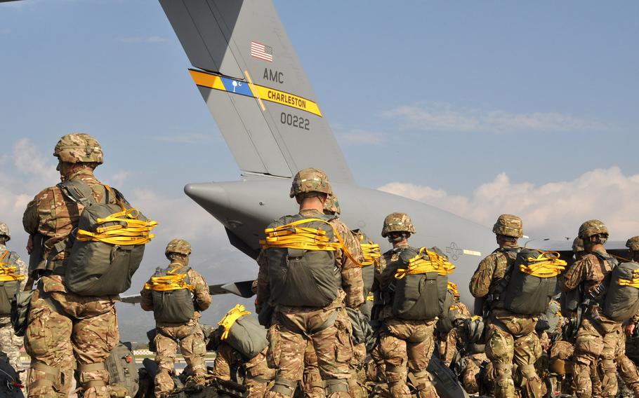 Soldiers from the 173rd Airborne Brigade participating in exercise Saber Junction are geared up and ready to go onto an awaiting C-17 at Aviano Air Base, Italy, on Tuesday, April 12, 2016..