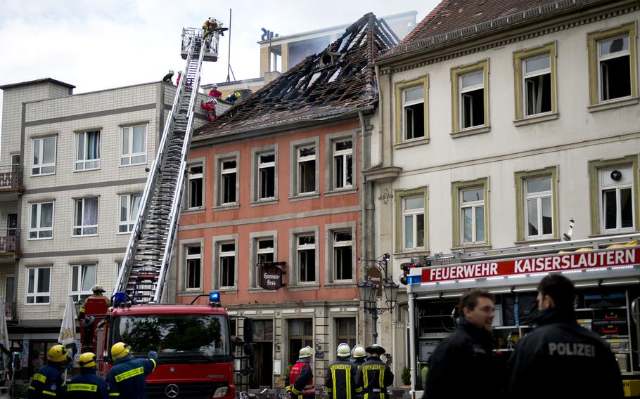 Firefighters inspect the Hannenfass restaurant in Kaiserslautern, Germany, on Tuesday, May 3, 2016. The restaurant caught fire around 2:15 a.m. The cause of the blaze is still under investigation.