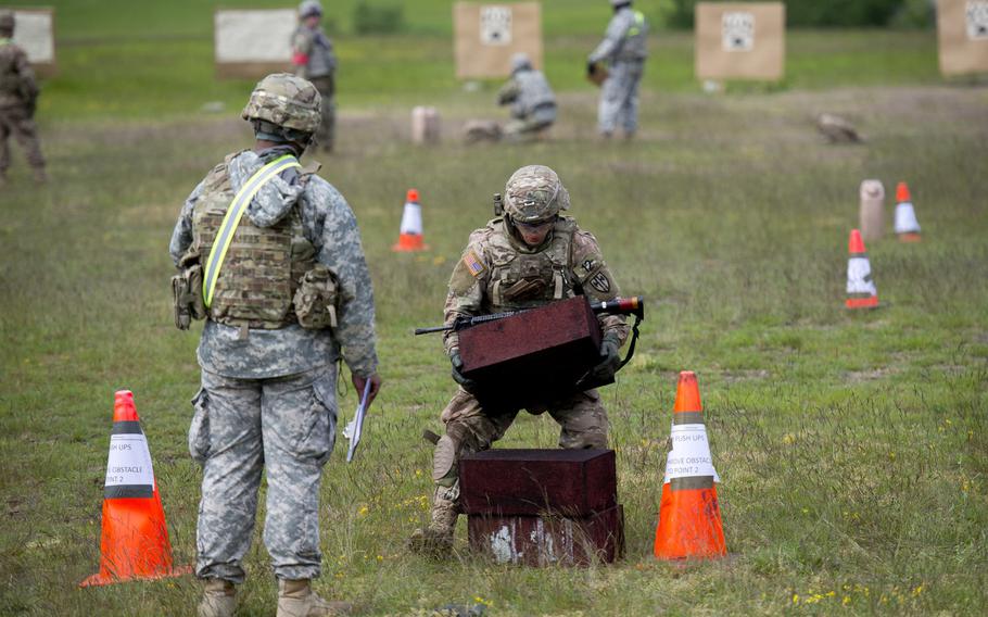 Soldiers perform a series of physical challenges before firing their rifles as part of the 21st Theater Sustainment Command Best Warrior Competition in Baumholder, Germany, on Monday, May 23, 2016.