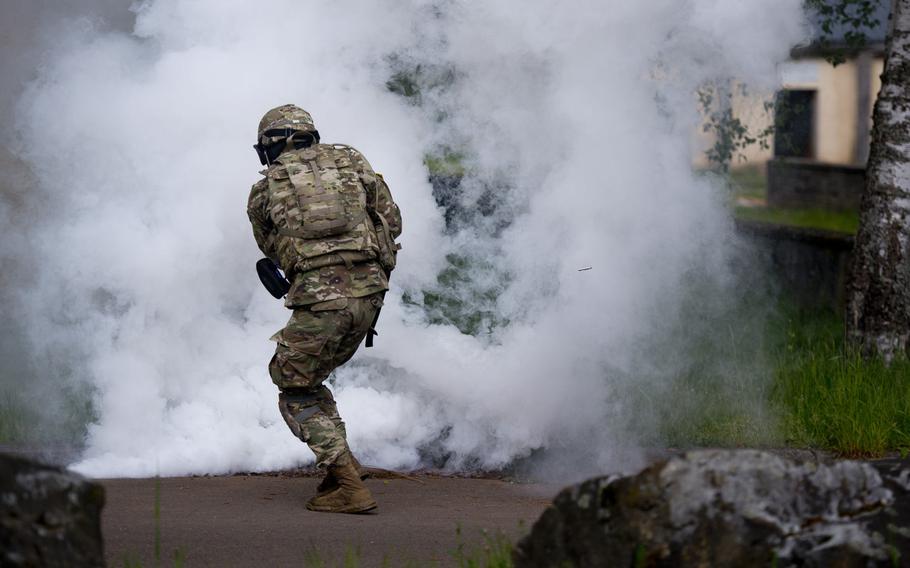 First Lt. Collin Welch moves to cover during a situational training exercise as part of the 21st Theater Sustainment Command Best Warrior Competition in Baumholder, Germany, on Monday, May 23, 2016.