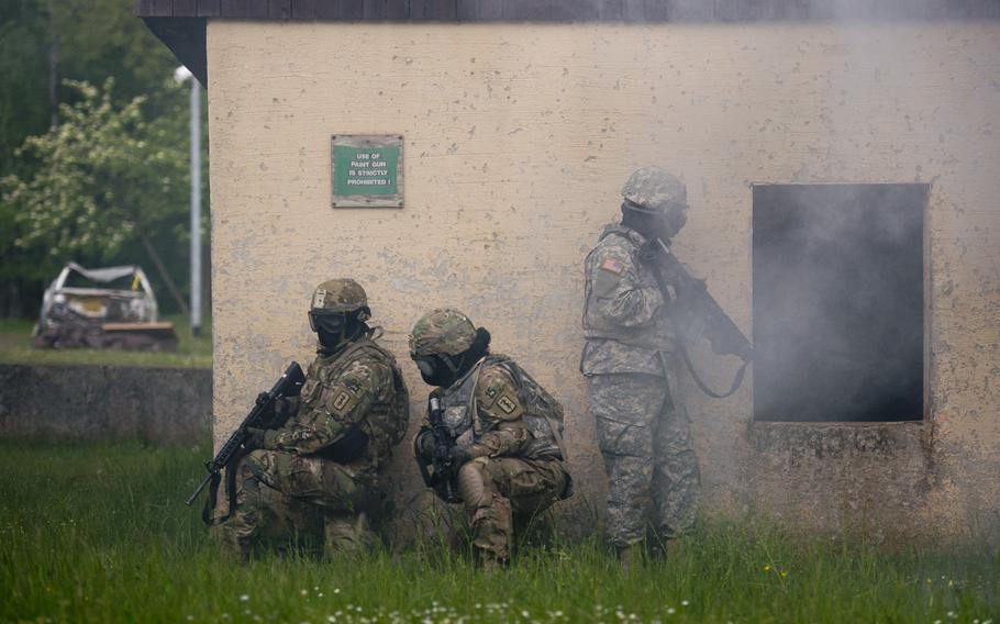 Competitors take cover during a situational training exercise as part of the 21st Theater Sustainment Command Best Warrior Competition in Baumholder, Germany, on Monday, May 23, 2016.