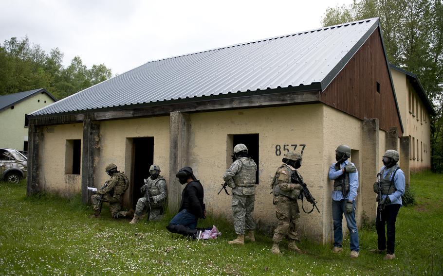 Competitors move a simulated high-value target during the 21st Theater Sustainment Command Best Warrior Competition in Baumholder, Germany, on Monday, May 23, 2016.