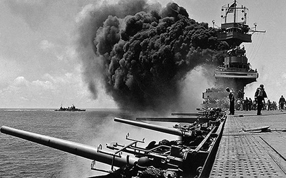 Smoke billows from the carrier USS Yorktown before in sank during the Battle of Midway in June 1942. During the battle, which lasted from June 3-7, 1942, Japan lost nearly 300 planes, a cruiser and four aircraft carriers, which had been among the six used in the surprise attack on Pearl Harbor a half-year earlier.