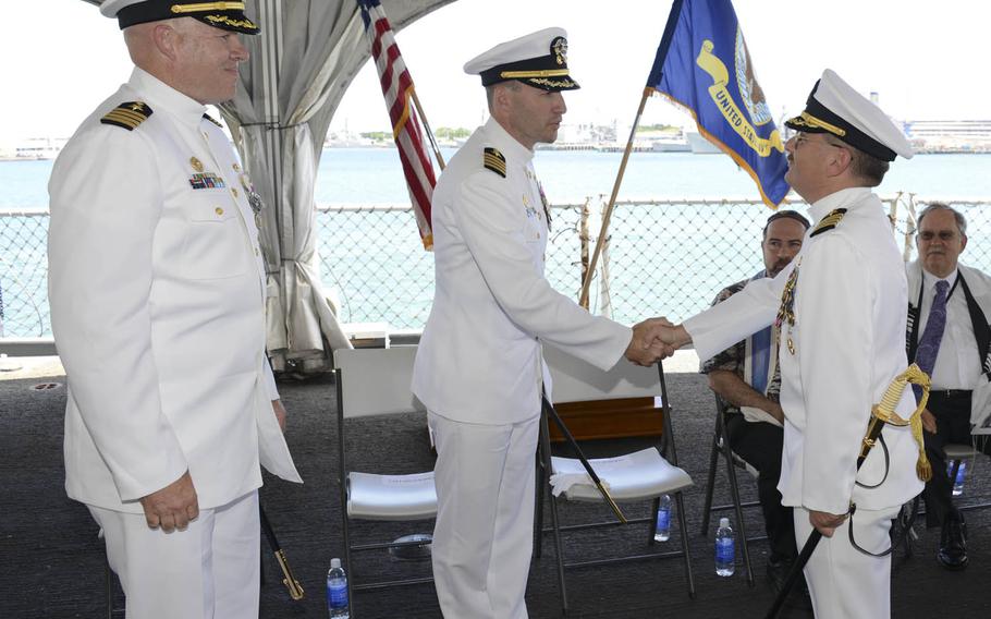 Capt. Howard Goldman, right, is congratulated by Capt. David Roberts, commanding officer of the Submarine Learning Center, as he relinquishes command of Naval Submarine Training Center Pacific to Capt. Michael Martin during a change of command ceremony in August 2014. Howard, who took command of Naval Undersea Warfare Center Newport Division in Rhode Island, has been fired after leadership problems.
