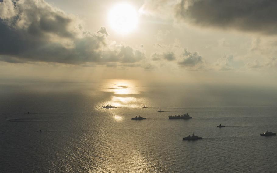Ships and submarines from the U.S. and Singapore navies gather in formation in the South China Sea during Cooperation Afloat Readiness and Training, July 21, 2015. 