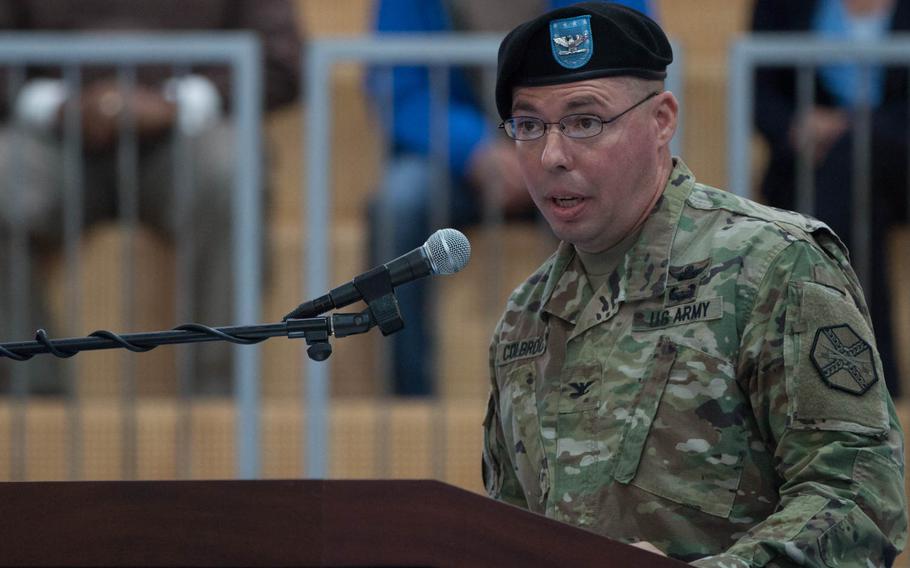 U.S. Army Garrison Bavaria's outgoing commander, Col. Mark Colbrook, speaks at a relinquishment of command ceremony in Grafenwoehr, Germany, on Friday, June 3, 2016.