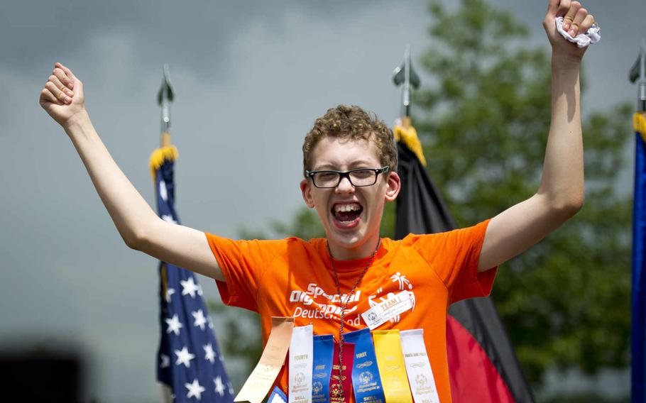 Wiesbaden High School's Conrad Grow celebrates receiving a medal during the Spring Special Olympics award ceremony at Ramstein Air Base, Germany, on Friday, June 3, 2016. 

Michael B. Keller/Stars and Stripes
