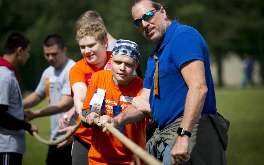 Joe Falcon, right, and Kaiserslautern High School's Johnny Karaca participate in the tug of war during the Spring Special Olympics at Ramstein Air Base, Germany, on Friday, June 3, 2016. 

Michael B. Keller/Stars and Stripes