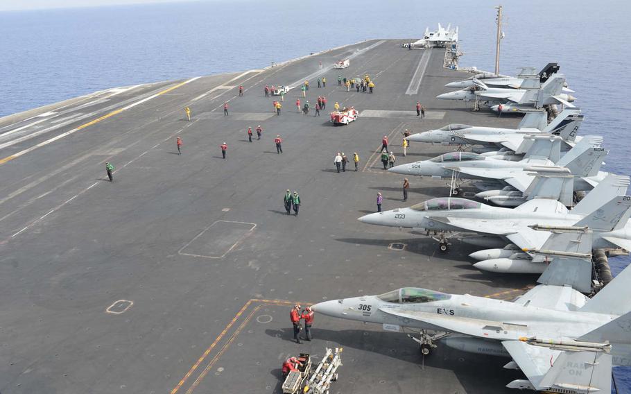 Crewmembers on the flight deck of the USS Harry S. Truman after several launches on Friday, June 3, 2016. The carrier conducted airstrikes from the Mediterranean Sea, the first action by a carrier in the region since 2003. 