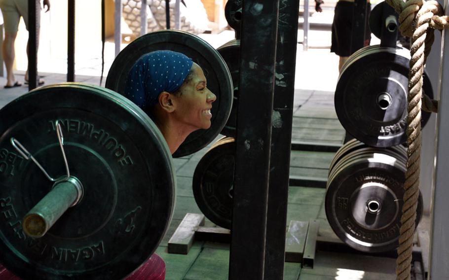Virsa Perkins, seen here performing a back squat during a CrossFit workout challenge during the Kabul Fitness Festival at the U.S. Embassy in the Afghan capital on May 27, 2016, said she started the high-intensity fitness regimen in April to cope with the stress of being posted to a war zone. About 200 people participated in the four-day fitness event, which featured dozens of sports and fitness activities.