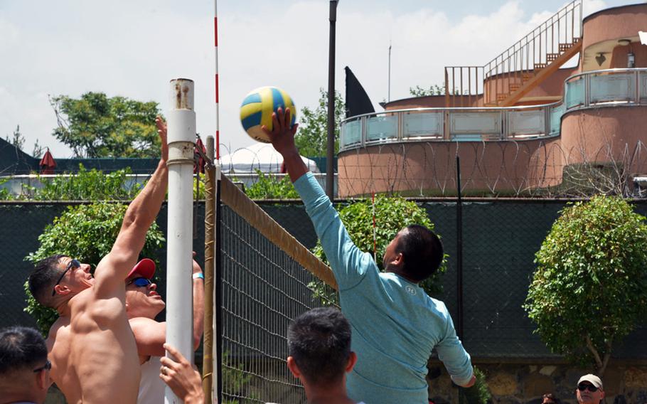 Workers at the U.S. Embassy in Kabul, pictured here playing volleyball during the Kabul Fitness Festival at the main embassy compound on May 28, 2016, organize frequent group fitness events and classes to stay fit and ward off the stresses of a war-zone posting.