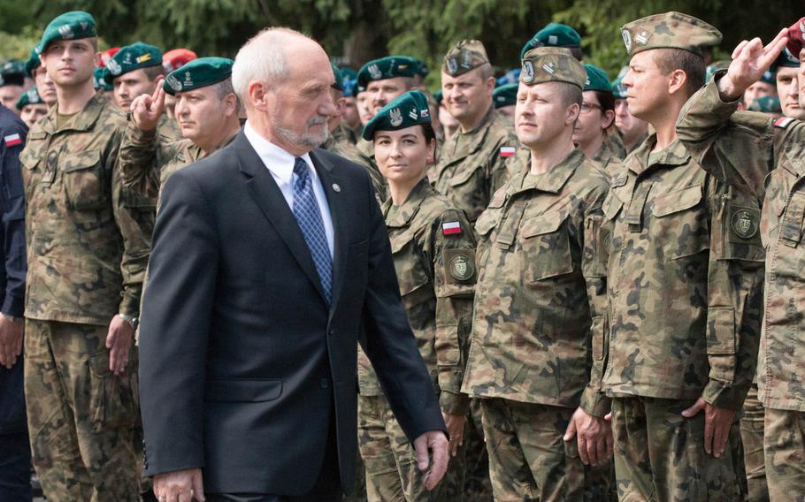 Polish Defense Minister Antoni Macierewicz passes by a formation of Polish and American soldiers during the opening ceremony of the multinational training exercise Anakonda 16 in Warsaw, Poland, Monday, June 6, 2016.