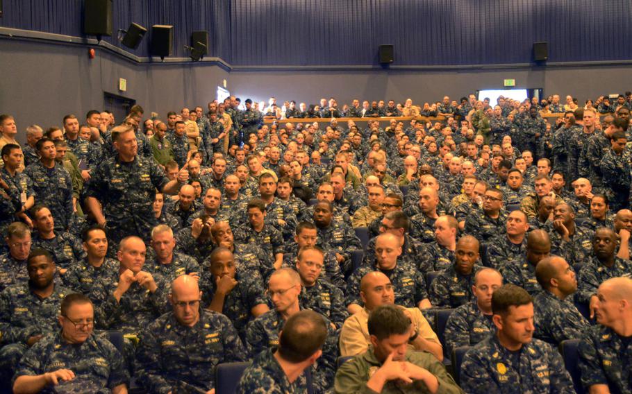 Sailors packed into the Fleet Theater ask questions about new restrictions on liberty and alcohol use for sailors in Japan, at Yokosuka Naval Base on June 7, 2016.
