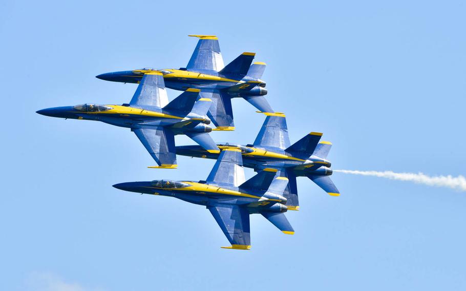 The Blue Angels perform the Diamond 360 maneuver at the Spirit of St. Louis Air Show, May 14, 2016. The Navy flying squadron has canceled aerial performances scheduled this month in New York and Ohio in the wake of a deadly crash that killed a pilot last week.