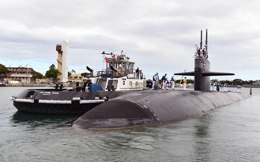 The Los Angeles-class fast-attack submarine USS Houston departs Joint Base Pearl Harbor-Hickam, Hawaii, for the final time, Monday, June 6, 2016. Houston is en route to Bremerton, Wash., for decommissioning after 33 years of service.