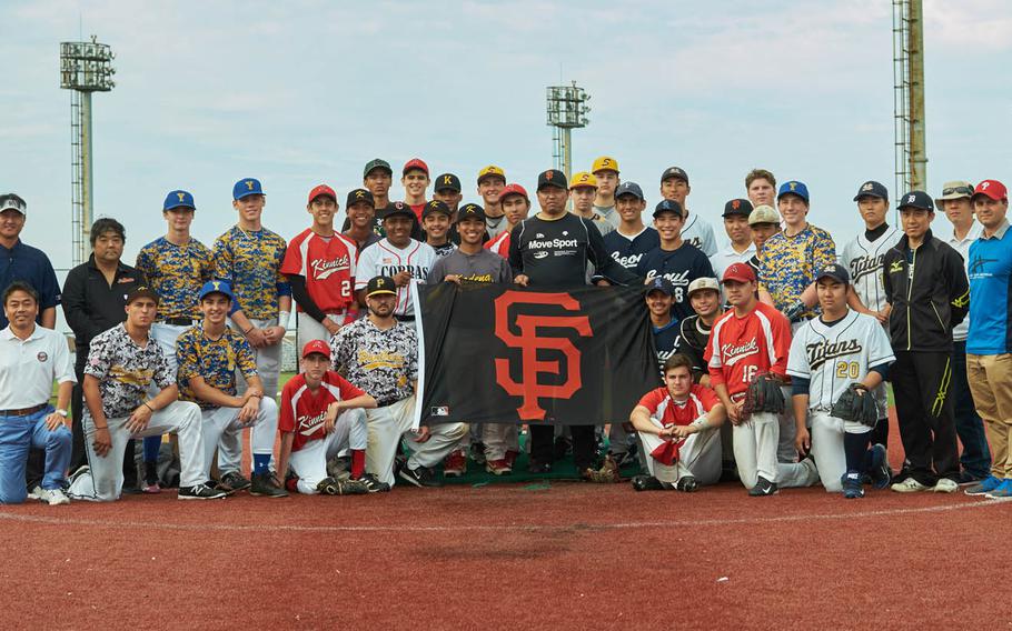 Keiichi Yabu, center, MLB scouts and Far East Baseball players from as far away as Seoul, South Korea, attend a pro-scout clinic at Nile C. Kinnick High School in Yokosuka, Japan, Sunday, June 5, 2016. The unfunded, all-volunteer clinic is in its fifth year.