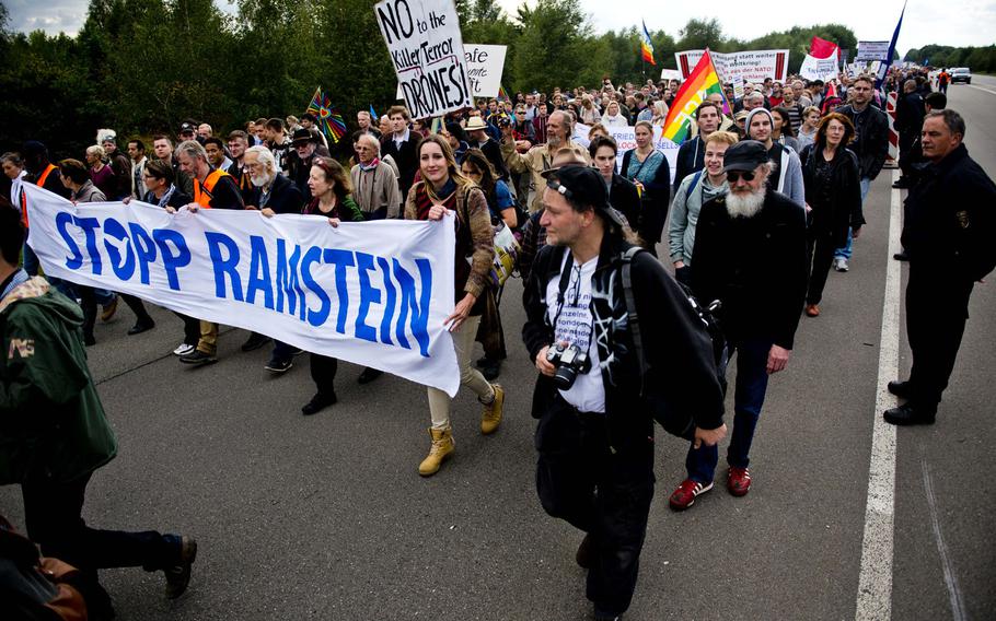 Protesters march to a demonstration outside Ramstein Air Base, Germany, Sept. 26, 2015. The group Stop Ramstein - No Drone War organized the event, and wants the base to stop being used in the U.S. drone program overseas. Thousands of peace activists from across Germany and abroad are expected to demonstrate again outside Ramstein Saturday against the base's alleged role in U.S. drone operations.