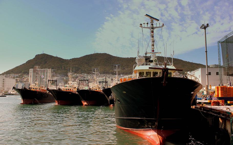 Fishing boats sit at a port in Busan, South Korea. U.S. and South Korean forces launched a rare operation against illegal fishing Friday, June 10, 2016, amid growing complaints about unauthorized Chinese boats in crab-rich waters.