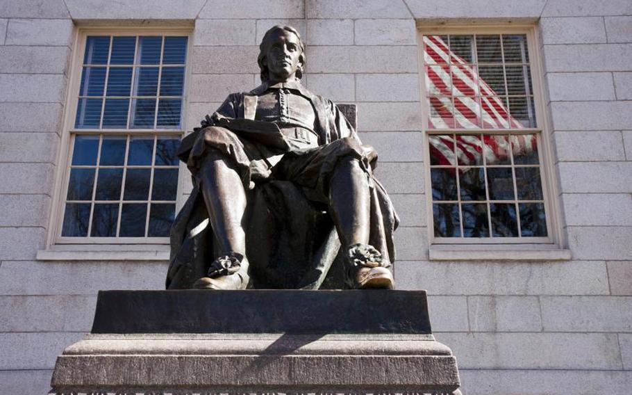 The John Harvard statue sits in Harvard Yard in this undated photo provided by Harvard University. ROTC programs for all services are active again at the university after a more than four-decade absence sparked by protests during the Vietnam War.
