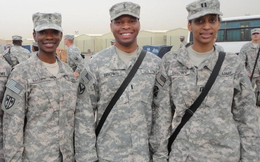 Captain Antonio Brown, center, during his deployment in Kuwait in 2010-2011. Courtesy of Sandra Brown (right).