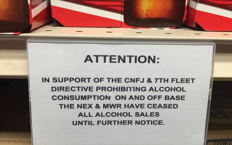 A sign at Yokosuka Naval Base, Japan, explains why alcohol sales have ceased at the commissary, Monday, June 6, 2016. 