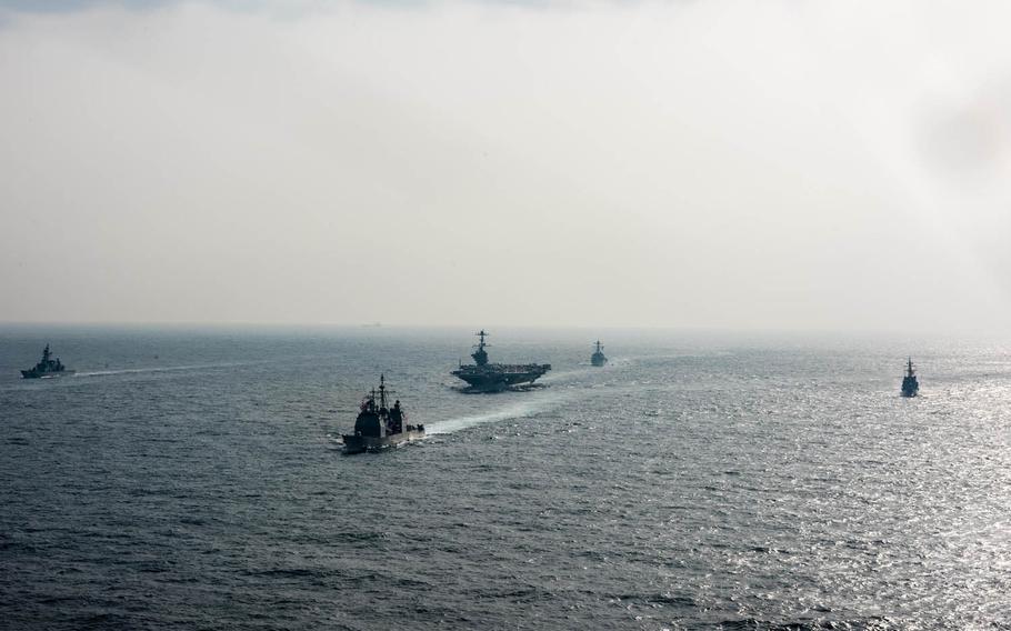 USS John C. Stennis, the guided-missile cruiser USS Mobile Bay, the guided-missile destroyer USS Chung-Hoon and the guided-missile destroyer USS Stockdale participate in a group sail with Japanese Maritime Self-Defense Force ships in the East China Sea, March 10, 2016. 