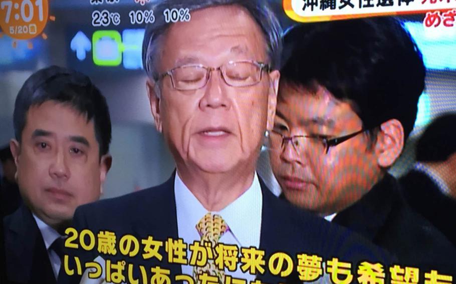 In this image taken from a Fuji Television broadcast, Okinawa Gov. Takeshi Onaga speaks to Japanese reporters about the death of an Okinawa woman, Friday, May 20, 2016. The staunchly anti-U.S. military governor will be among an estimated 50,000 people attending an island-wide demonstration against the U.S. military on Sunday in Naha.