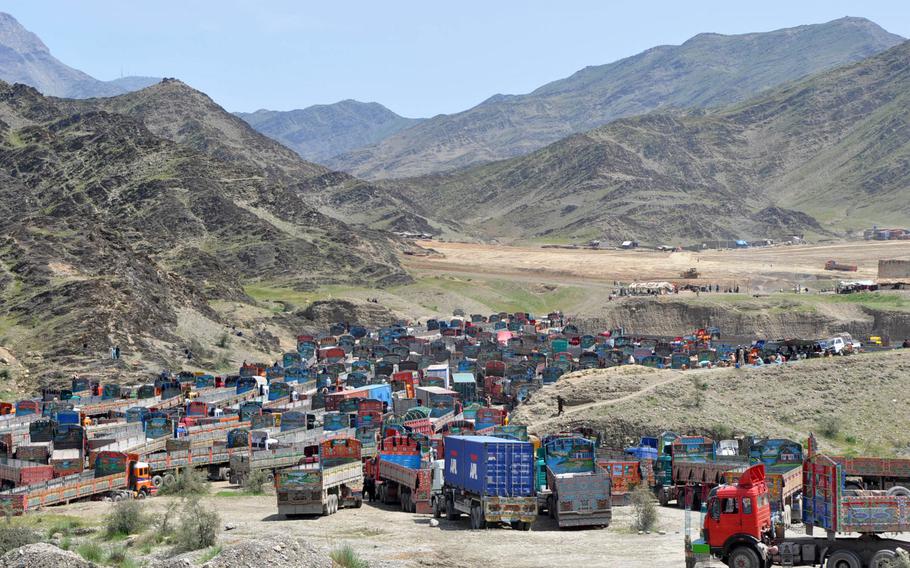 Hundreds of trucks wait to enter Pakistan at the the border crossing at Torkham Gate in Afghanistan. Pakistani and Afghan forces exchanged fire on Sunday, June 12, 2016, over construction on the Pakistani side of the border.
