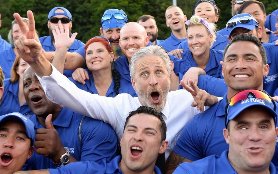 Television and movie personality Jon Stewart, most notably of The Daily Show, poses for a photo with the Air Force team for the 2016 Department of Defense Warrior Games June 15, 2016. Stewart emceed the opening ceremonies for the games. (Department of Defense photo by EJ Hersom)