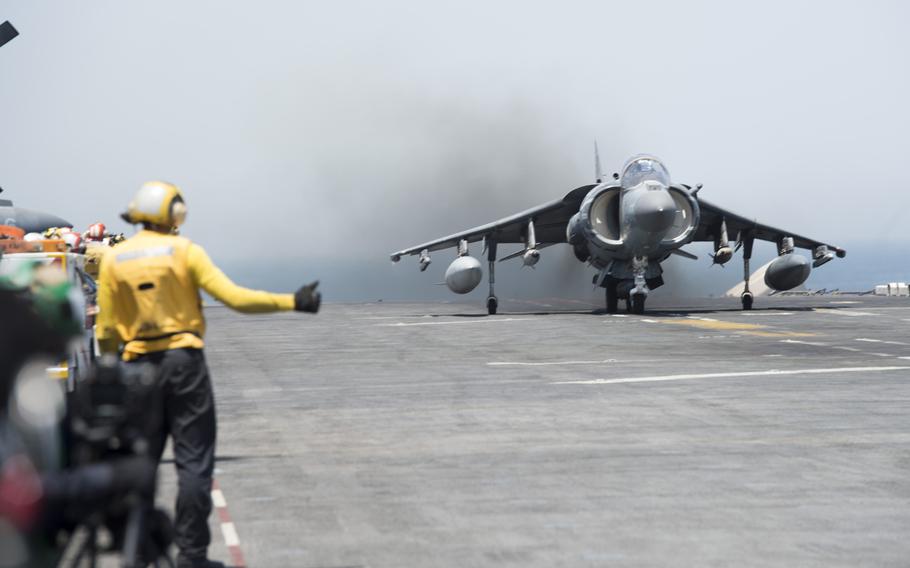 A Marine Expeditionary Unit AV-8BII Harrier launches from the amphibious assault ship USS Boxer on Thursday, June 16, 2016, targeting Islamic State group militants.