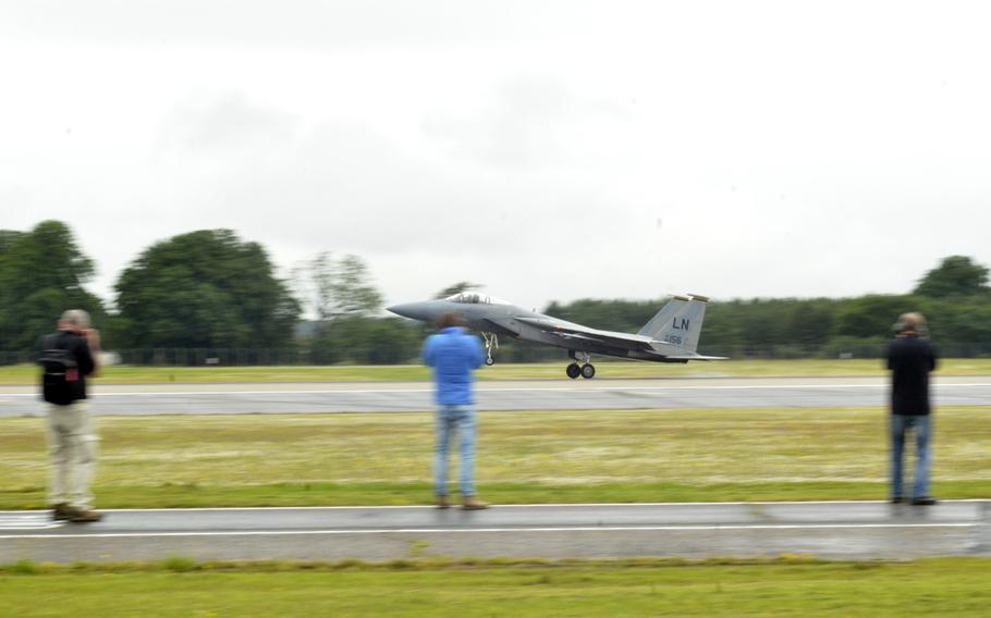 Aviation Enthusiasts photograph an F-15C Eagle of the 493rd Fighter Squadron landing at RAF Lakenheath, Wednesday, June 22, 2016. This was the second time RAF Lakenheath invited amateur and professional photographers an opportunity to document aircraft up-close and in action.