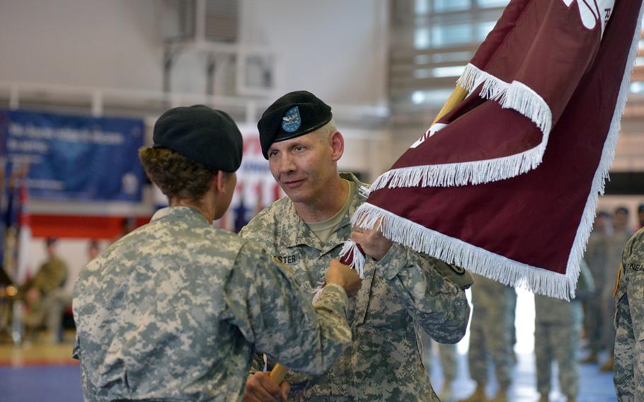 The new commander of the Regional Health Command Europe, Col. Dennis LeMaster, takes the unit's colors from Lt. Gen. Nadja West, the Army surgeon general and commander of U.S. Army Medical Command, at RHCE's change of command ceremony in Sembach, Germany, Friday, June 24, 2016. LeMaster took command from Brig. Gen. Norvell Coots, who is retiring.