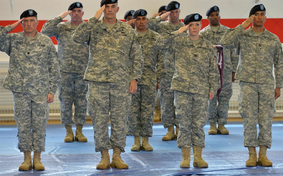 Soldiers salute during the playing of the national anthems at the Regional Health Command Europe's change of command ceremony in Sembach, Germany, Friday, June 24, 2016. Col. Dennis LeMaster took command from Brig. Gen. Norvell Coots.
