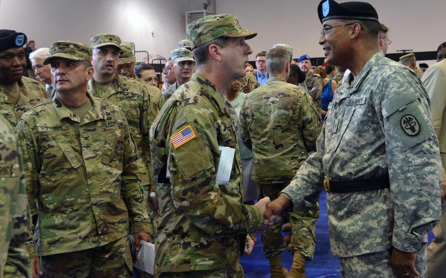 Brig. Gen. Norvell Coots, right, the outgoing commander of Regional Health Command Europe, says goodbye to troops following the change of command ceremony in Sembach, Germany, Friday, June 24, 2016. Col. Dennis LeMaster took command of the unit.