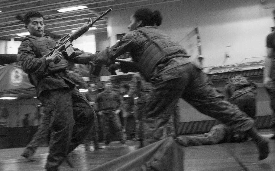 Cpl. Princesse Aldrete executes a disrupt-and-thrust technique during Marine Corps Martial Arts Program training on the amphibious assault ship USS Boxer June 17, 2016.