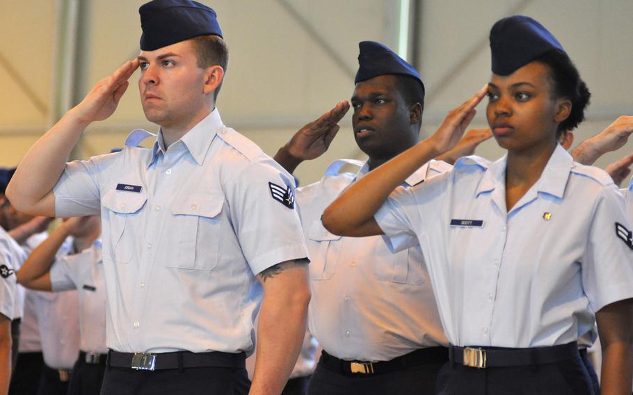 Airmen offer their salutes to 31st Fighter Wing leadership during a change of command ceremony at Aviano Air Base, Italy, Friday, June 10, 2016. With the Marines removing 'man' from some job titles, will airmen be called something else?