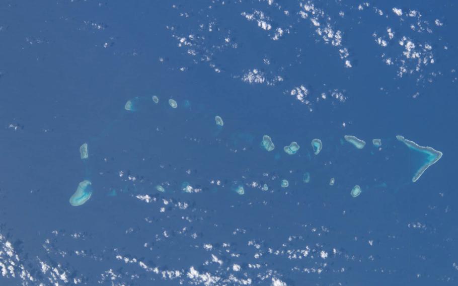 The South China Sea and part of the Spratly Islands are seen in this 2014 image taken from the International Space Station. China has delivered a new statement rejecting any ruling by an international court over its actions in the sea, potentially putting Beijing at odds with the United States and Asia-Pacific nations.