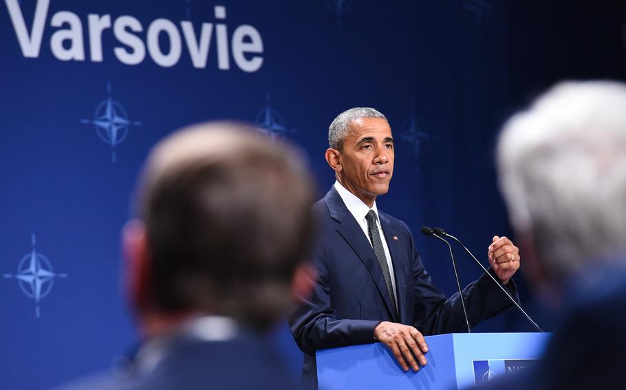 Defense Secretary Ash Carter, left, and Secretary of State John Kerry, right, look on as President Barack Obama addresses reporters on Friday, July 8, 2016, at the NATO Summit in Warsaw, Poland. Obama announced the U.S. will add a battalion of Army soldiers and headquarter a rotational brigade combat team in Poland next year.