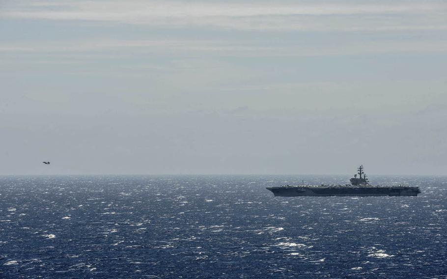 An F/A-18 Super Hornet launches from the flight deck of the USS Ronald Reagan in the South China Sea, July 7, 2016.