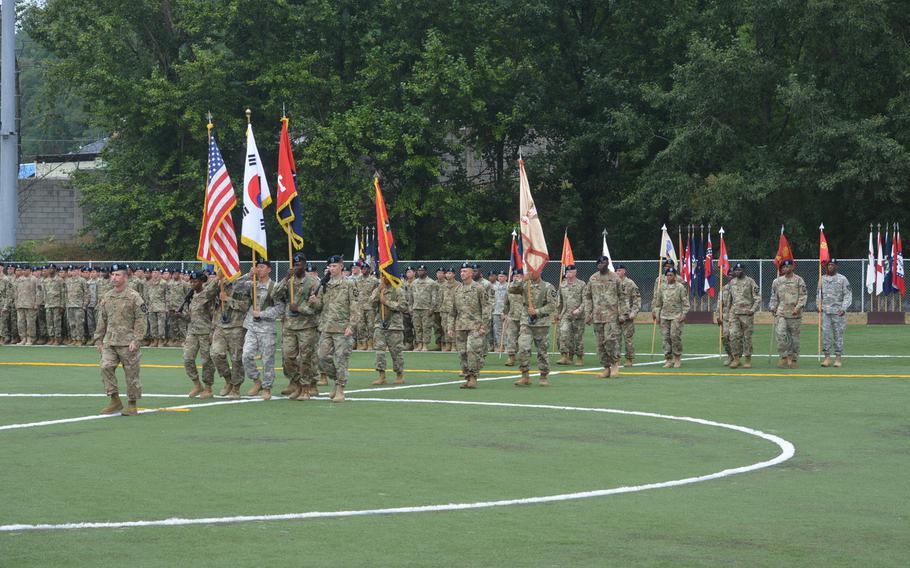 Lt. Col. Robert Slosson marches forward with the colors prior to the passing of the Brigade colors during the change of command for the 2nd Sustainment Brigade at Camp Carroll, South Korea, Wednesday July 20, 2016