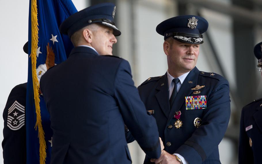 Brig. Gen. Jon Thomas, outgoing 86th Airlift Wing commander, relinquishes command during the wing's change-of-command ceremony at Ramstein Air Base, Germany, on Wednesday, Aug. 17, 2016.