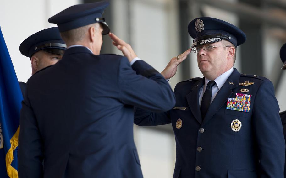 Brig. Gen. Richard Moore, incoming 86th Airlift Wing commander, assumes command during the wing's change-of-command ceremony at Ramstein Air Base, Germany, on Wednesday, Aug. 17, 2016.