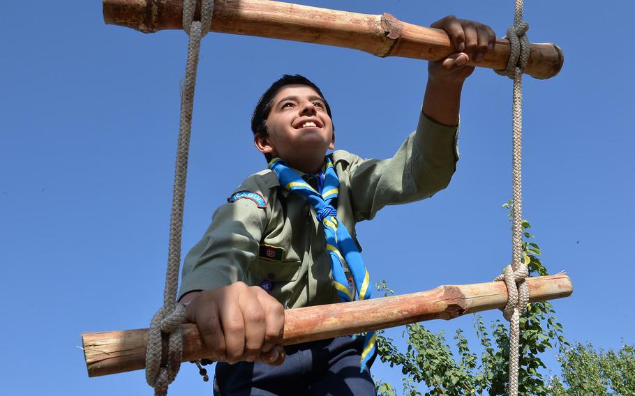 Hujatullah Stanakzai, 12, climbs a rope ladder on Sept. 8, 2016. The obstacle was part of a multistation confidence course for six Afghan scouting troops in Kabul during a three-day camping event. The scouting movement, which disappeared after the Soviet invasion in 1979, is making a comeback in Afghanistan, seen as a way of developing important life skills.