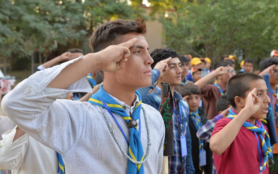 Said Khudadad Hosaini, 18, salutes during a formation for Afghanistan's Troop 3 at a three-day camping event in Kabul for six units in the country's nascent scouting program.