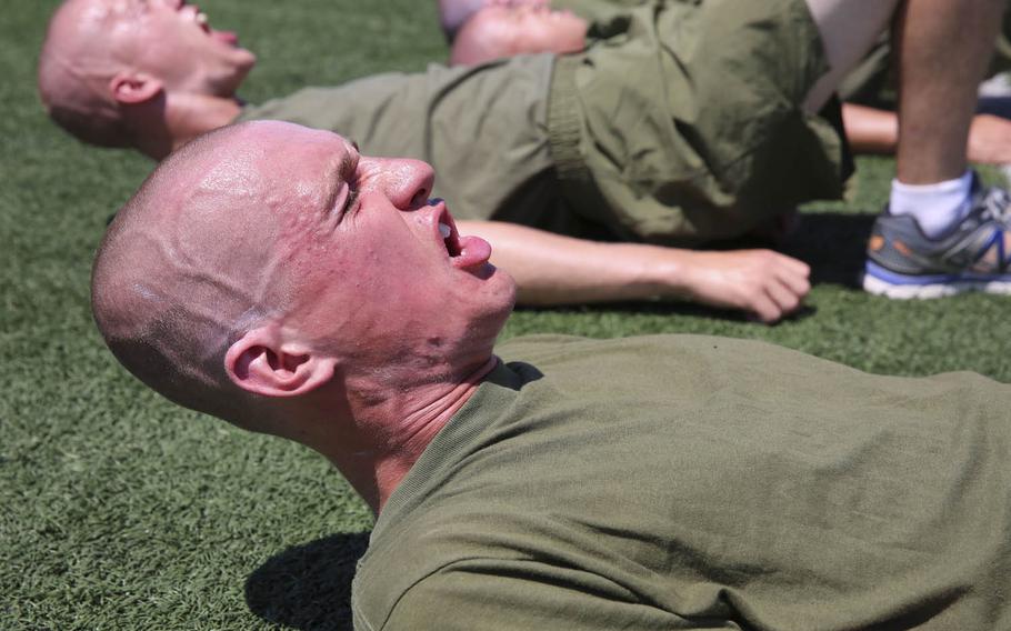 Marine Corps recruits do leg exercises during a circuit course at Marine Corps Recruit Depot San Diego, in August. The service is taking applications for its newest military occupational specialty: force fitness instructor.