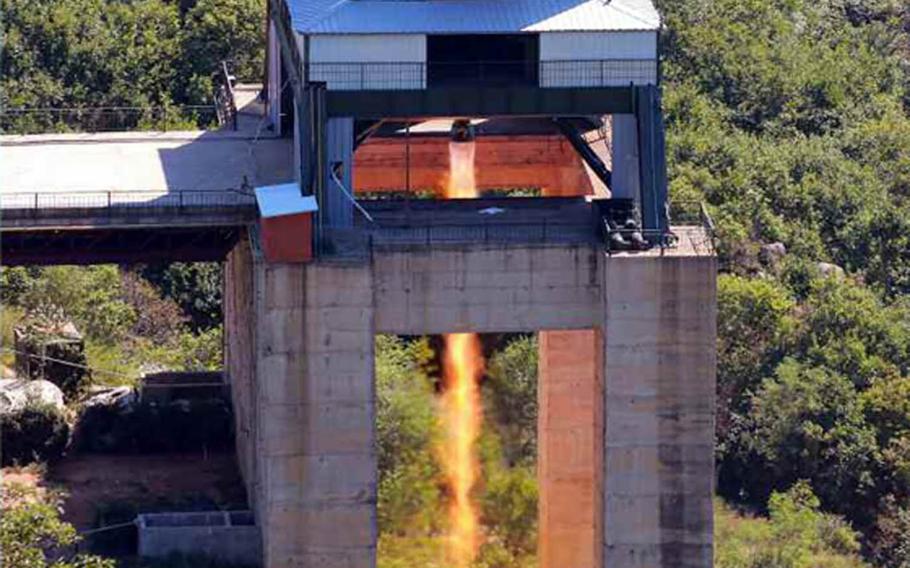 This photo published in the Tuesday, Sept. 20, 2016, edition of North Korea's official Rodong Sinmun newspaper purports to show a successful rocket-engine test attended by leader Kim Jong Un.