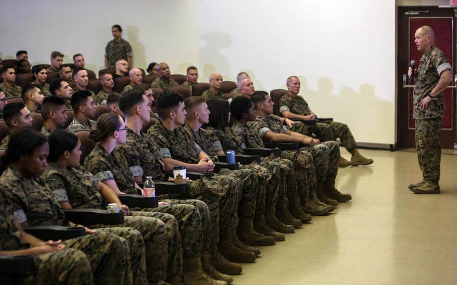 Marine Corps Commandant Gen. Robert Neller talks with Marines and sailors Thursday, Oct. 13, 2016, at Camp Kinser, Okinawa, Japan. He touched on a range of topics, from hazing to alcohol abuse, and told Marines it is time to adapt to new potential adversaries, to embrace technology and to be ready to fight at a moment's notice.